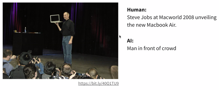 Alt text comparison. Human wrote: "Steve Jobs at Macworld 2008 unveiling the new Macbook Air." AI wrote: "Man in front of a crowd."