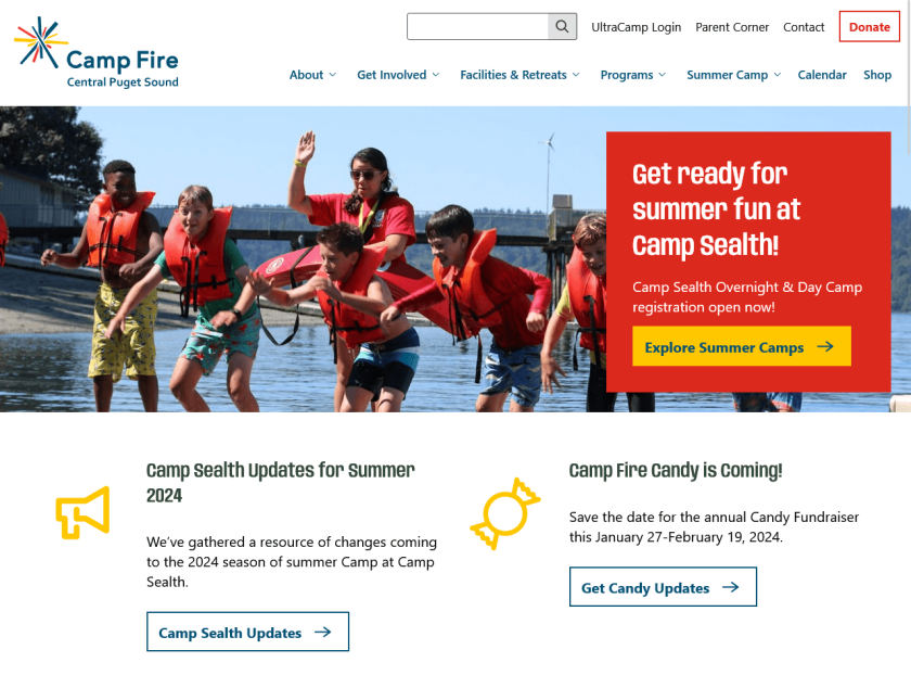 The Camp Fire home page has a full-width banner image of children jumping off a floating dock with a banner announcing summer camp signup. Two features with yellow icons below the banner announce other upcoming news items