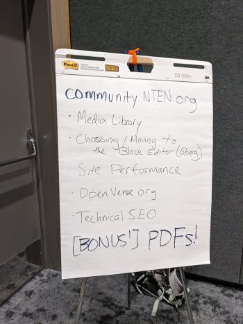 A easel notepad with a list of discussion topics for the WordPress community lean coffee session.